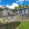 multi level building with metal fences and green grass