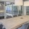 boardroom table with chairs and large windows