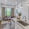 kitchen with large island and sink with living room and bedroom in view
