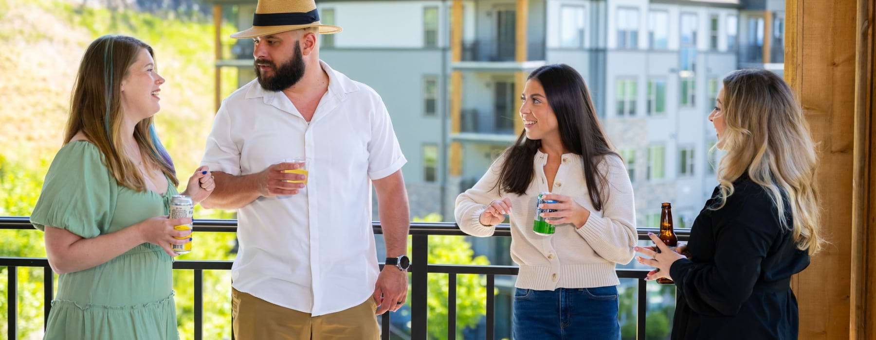 Residents enjoying beverages and entertainment at the mountain lookout of a luxury apartment community in Asheville, NC