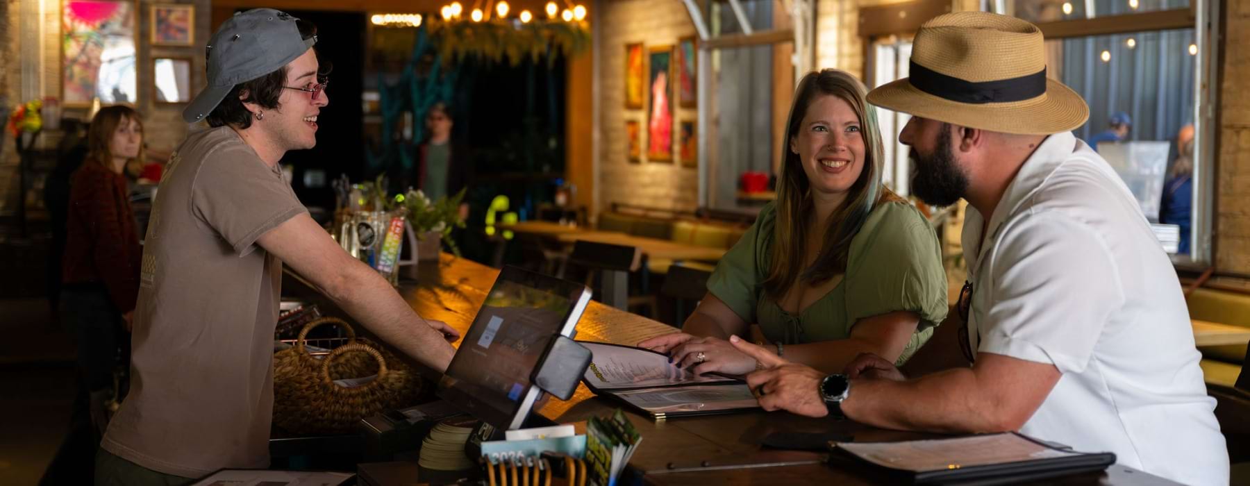 Residents enjoying food and beverages at a local hang out in Asheville, NC