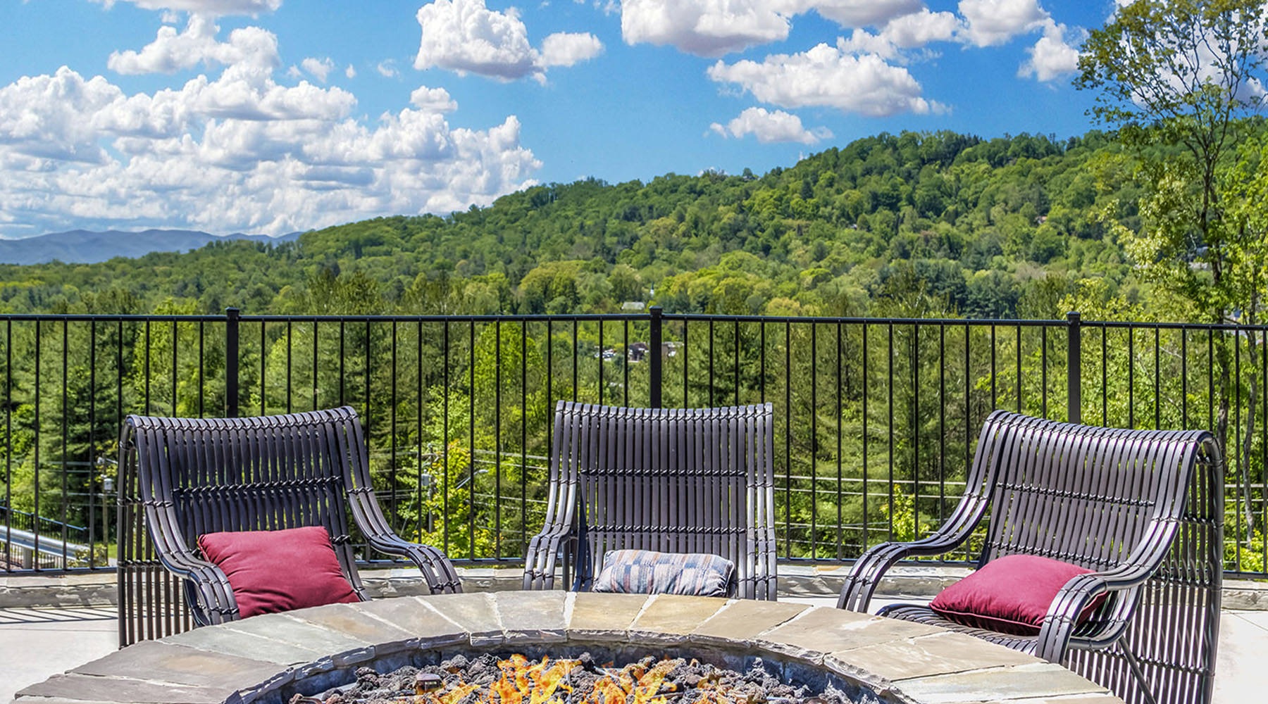 3 chairs in front of the mountains