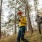 Man and woman walking through wooded trail