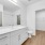 large lighted vanity sink and counter in bathroom