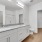 double sink in bathroom with walk-in closet