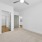 large, carpeted bedroom