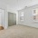 double door closet in spacious bedroom with natural lighting