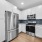 open countertop in c-shaped kitchen looking out toward glass door with access to private balcony