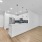 large living room with ceiling fan and light fixture next to kitchen